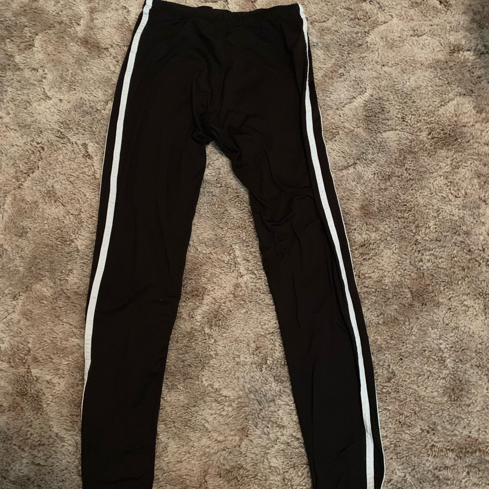 Black leggings with white stripes on sides